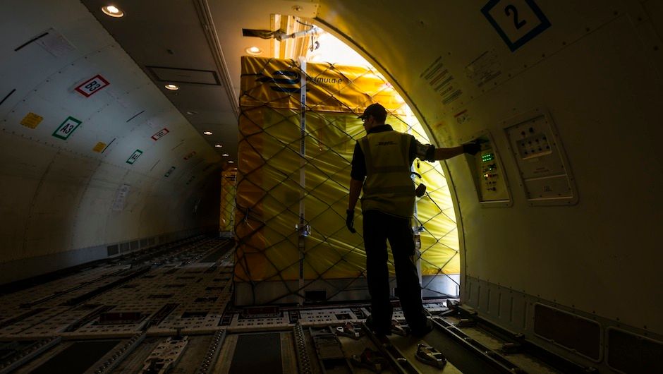 Each box is carefully positioned in the belly of the plane