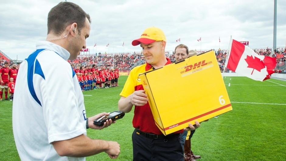 DHL special delivery! Ref signs for the game ball.