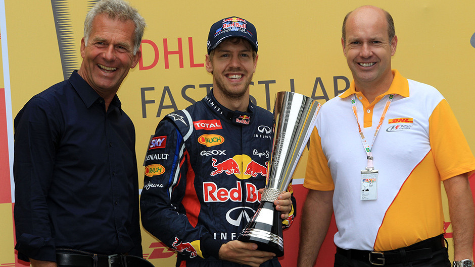 Vettel received the 2012 DHL Fastest Lap Trophy from DHL’s F1 Ambassador and former F1 driver, Christian Danner, and DHL Express Brazil CEO, Joakim Thrane in São Paulo last year.
