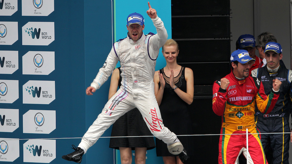 The Virgin Racing driver celebrates as he walks out onto the podium