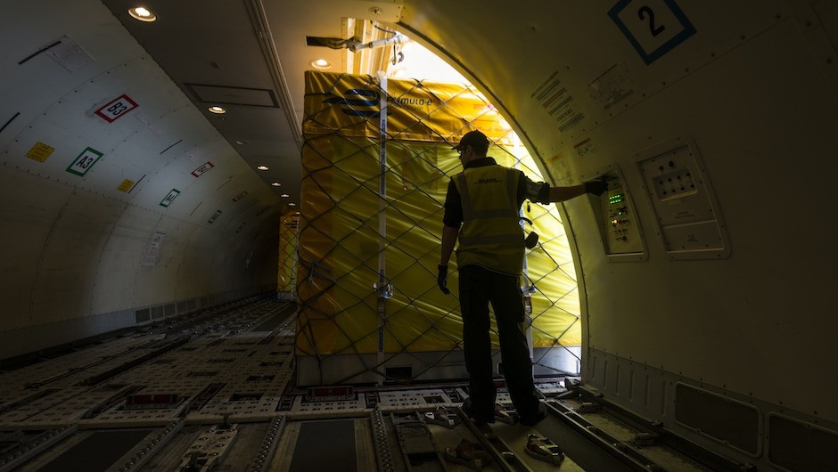 Each box is carefully positioned in the belly of the plane