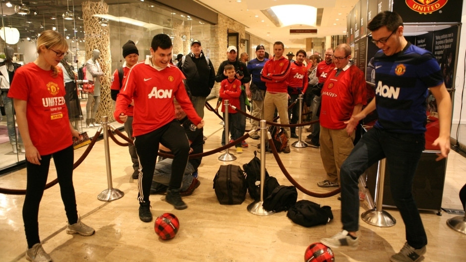 Fans in Chicago entertain themselves while waiting to see the silverware