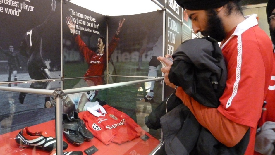 Checking out memorabilia from Old Trafford Museum