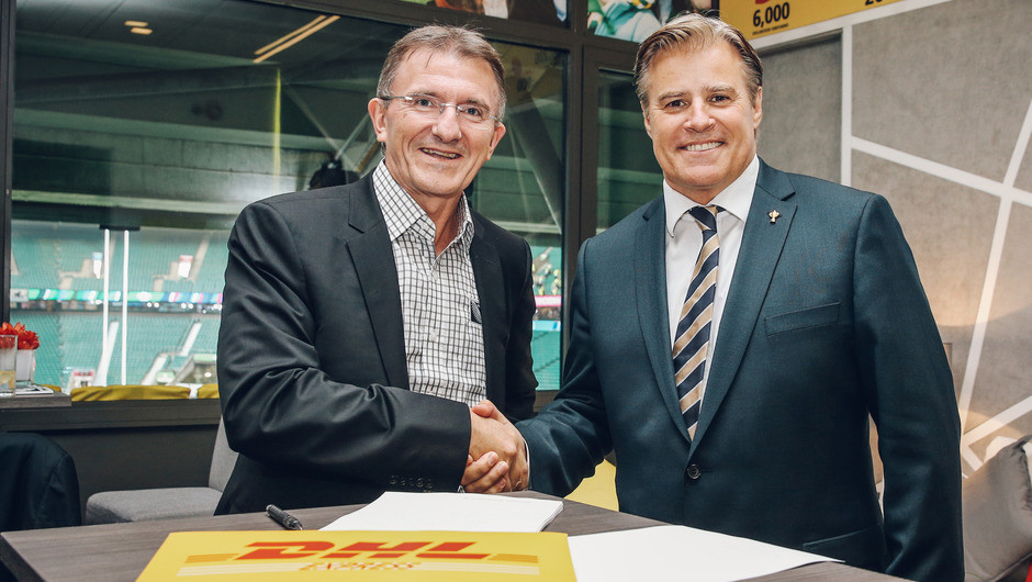 Ken Allen, CEO, DHL Express signs a new partnership deal with World Rugby CEO Brett Gosper