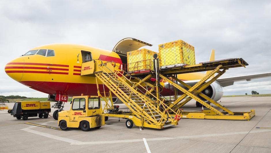 One by one the boxes are loaded into the cargo hold