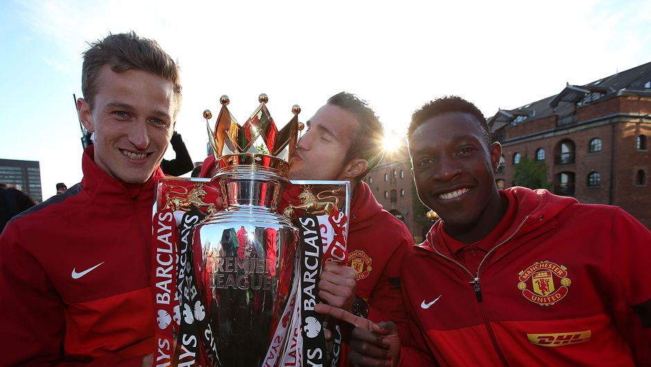 Anders Lindegaard, Robin Van Persie and Danny Welbeck celebrate with the Premier League Trophy