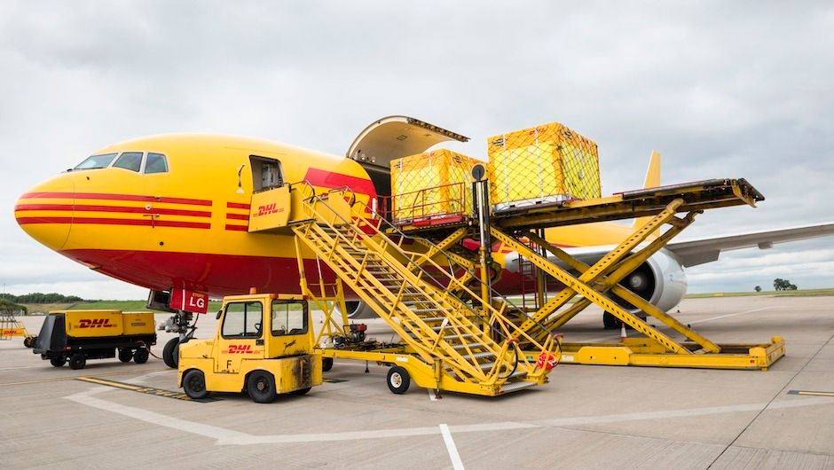 One by one the boxes are loaded into the cargo hold
